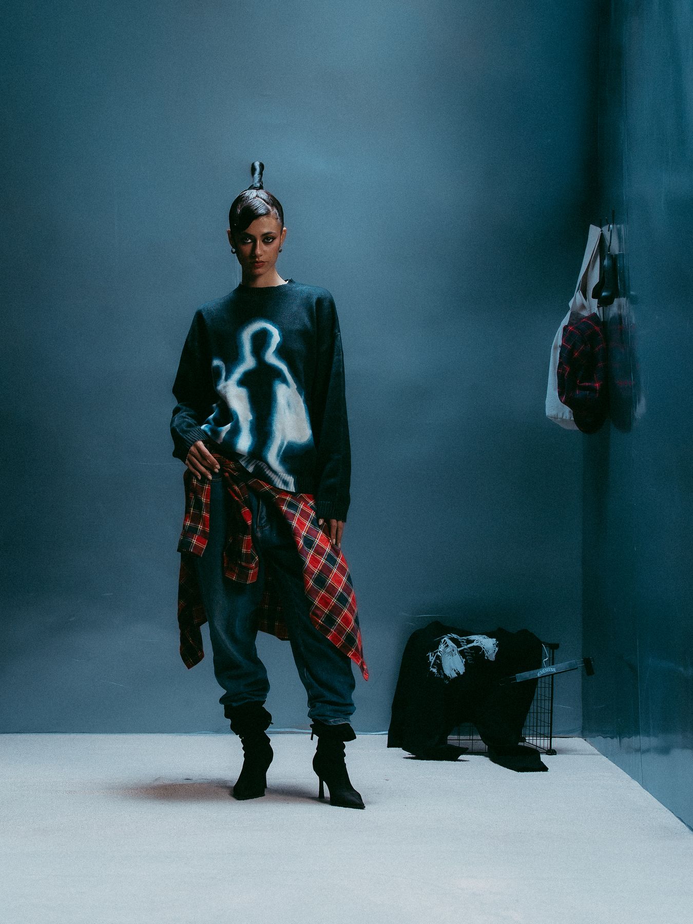 Model with a plaid shirt tied at the waist