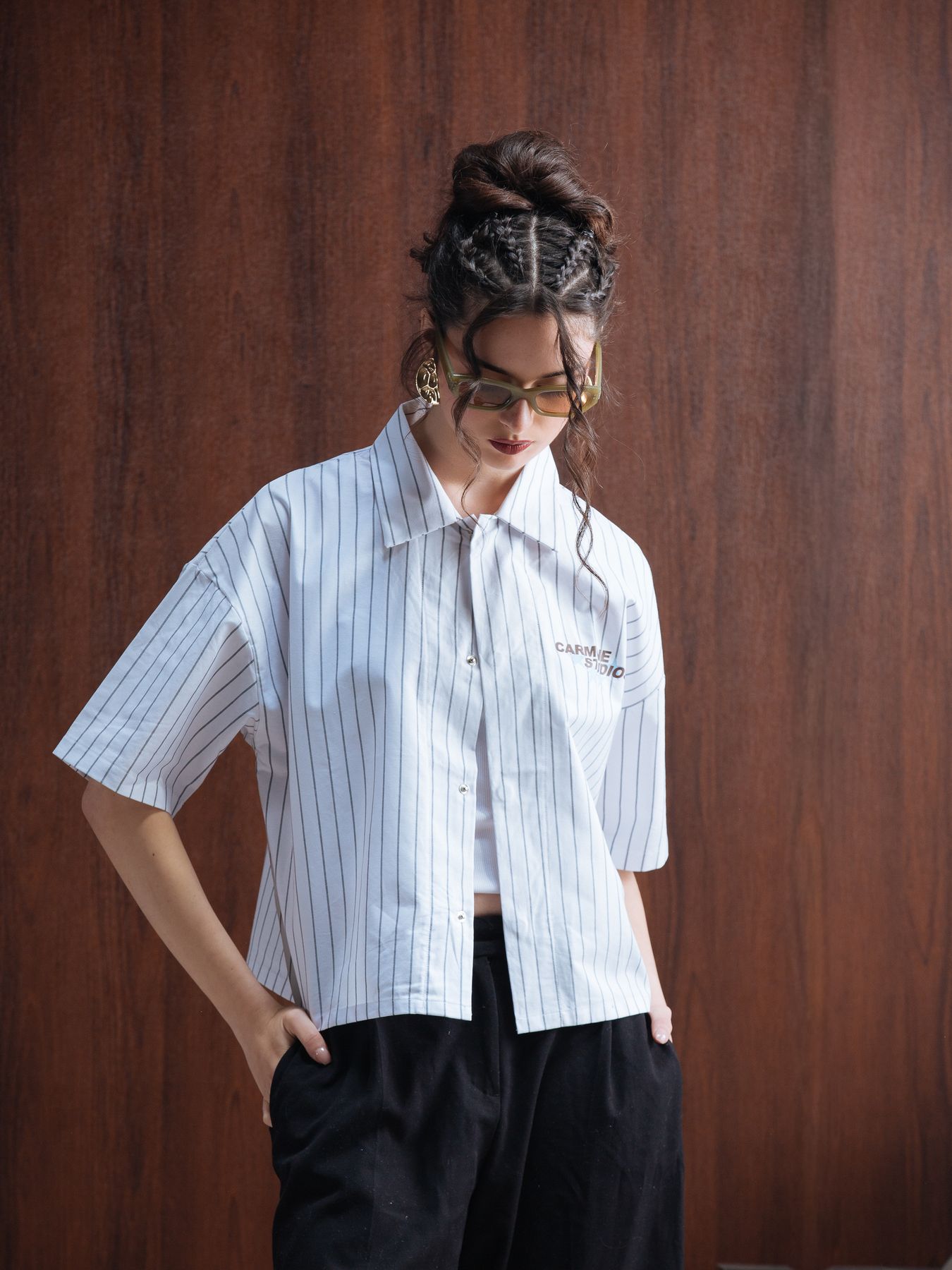 Model in a pale striped shirt